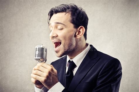 Man Singing Into A Microphone Stock Image Image 36063661