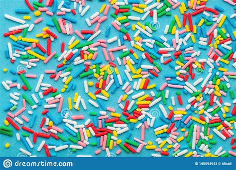 Top View Of Colorful Sprinkles Over Blue Festive Decoration For