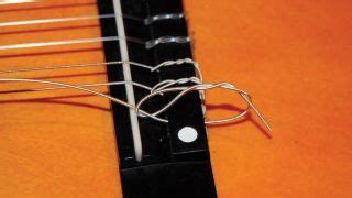 Classical guitars are definitely trickiest to restring. Guitar setup: how to restring a nylon-string classical ...