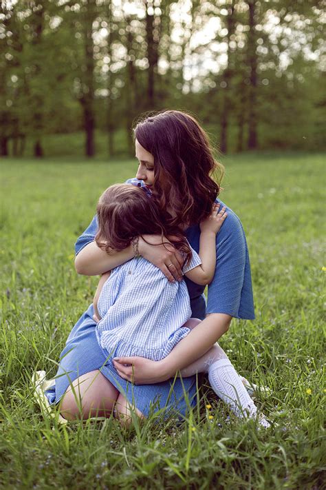 Mom And Daughter Are Sitting On A Green Meadow Photograph By Elena Saulich Fine Art America