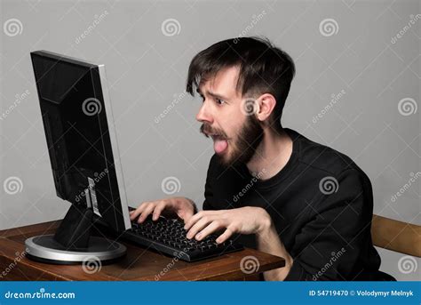 Funny And Crazy Man Using A Computer Stock Photo Image Of Background