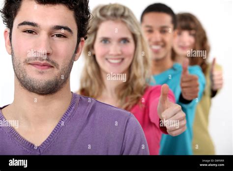 Young Group Of People Giving The Thumbs Up Stock Photo Alamy