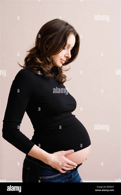 Pregnant Woman Holding Her Belly Stock Photo Alamy