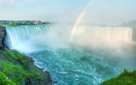 A Beautiful Rainbow Forms Over The Edge Of Horseshoe Falls In Niagara