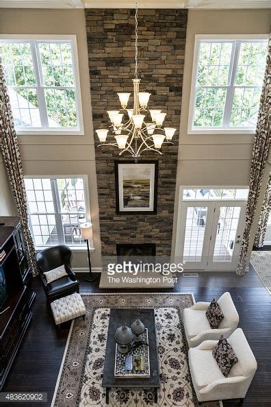 Amazing Two Story Great Room Layout Fllor To Ceiling Stone Fireplace
