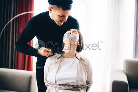 Robber Maniac Tied Female Victim To A Chair Stock Photo Crushpixel