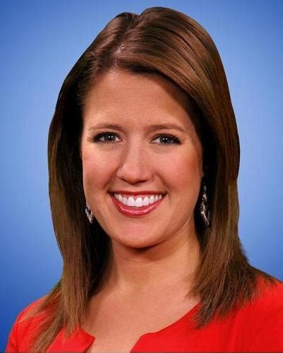 A Woman In A Red Top Smiling For The Camera With Blue Background And