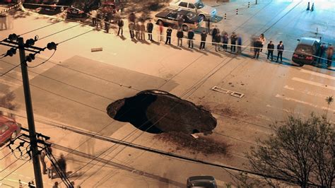 Pictures Sinkhole Opens In Beijing Road Swallows Truck