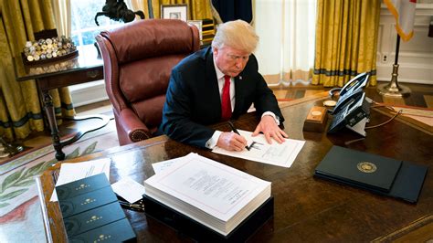In Signing Sweeping Tax Bill Trump Questions Whether He Is Getting