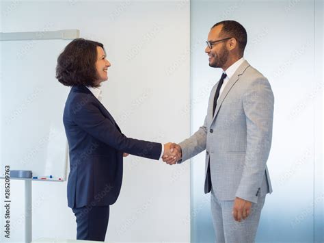 Cheerful Female Manager Greeting Male Newcomer Happy Business Man And