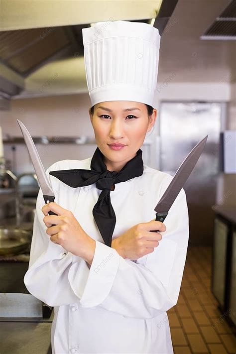 Confident Female Cook Holding Knives In Kitchen Young Adult Chefs Whites Sharp Photo Background