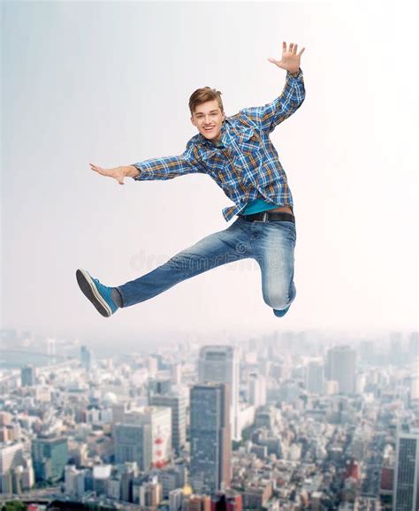 Smiling Young Man Jumping In Air Stock Image Image Of Carefree