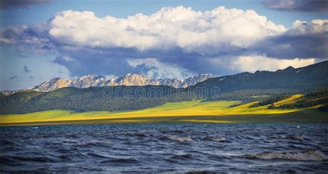 There Are Lakes And Grasslands Under The Blue Sky And White Clouds