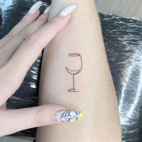 One Line Wine Glass Tattoo On The Inner Forearm