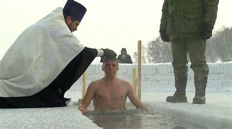 Russian Orthodox Epiphany Siberian Believers Plunge Under Icy Water In