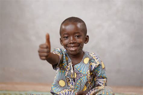 Unbelievably Happy African Black Boy With Thumbs Up And Copy Space