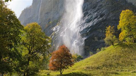 Download Wallpaper 1366x768 Waterfall Rock Trees Landscape Tablet