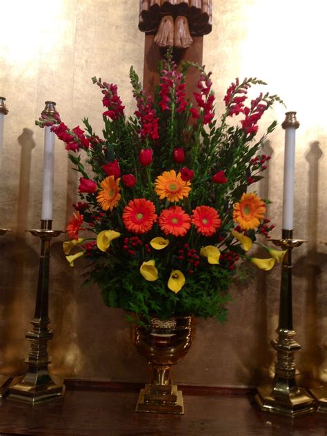 The spring collection features softer colors, brighter greens and incorporation of tulips, daffodils, iris and tree. Pentecost Arrangement | Altar flowers, Church flower ...