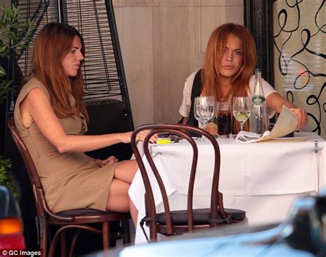 Lindsay Lohan Sports Ripped Skinny Jeans As She Dines Out At Scotts Hours After Flying Back