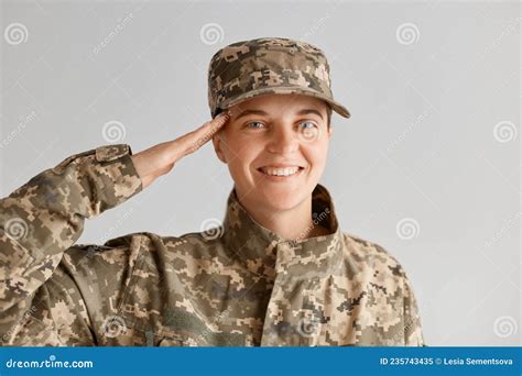 Portrait Of Happy Smiling Caucasian Woman Army Soldier Saluting While