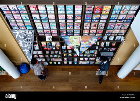 Visitors Enjoy Reading Comics At The Kyoto International Manga Museum In Kyoto Japan On 13 Nov