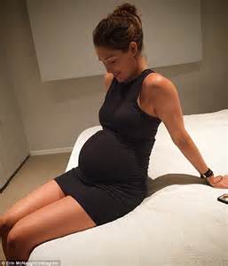 erin mcnaught shows off her 35 week bump in a clinging jersey dress as she marvels at the