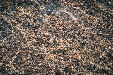Hd Wallpaper Close Up Photo Of Brown And Black Stones Water Sea