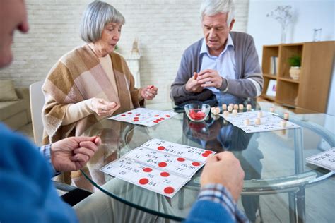 A Group Of Seniors Playing Games Together Giving Care By Silverts