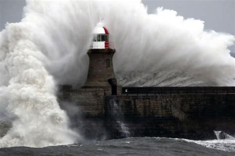 Waves Crash Over Souter Lighthouse As The Weather Continues To Wreak
