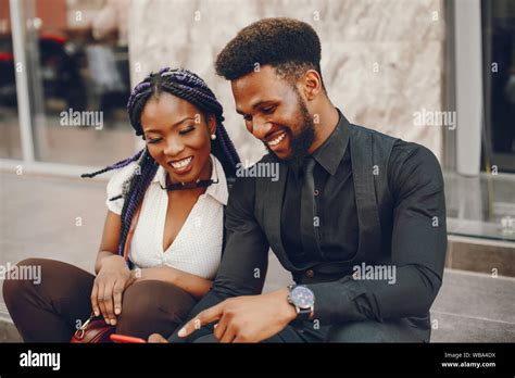 A Stylish And Beautiful Dark Skinned Couple In A City Stock Photo Alamy