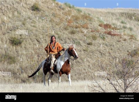 A Native American Lakota Sioux Indian Riding Horseback On The Prairie