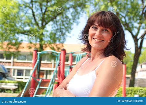 beautiful happy mature caucasian woman outside in the park stock image image of casual