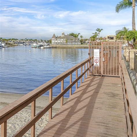 Docks Overlooking The Sea And Waterfront Houses In Huntington Beach