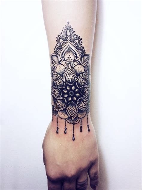 This tattoo on a bended zone, for example, the shoulder or lower arm could bring about an 'extended' look template and could make the circle lose its. Cuff tattoo, Wrist tattoos, Hand tattoos