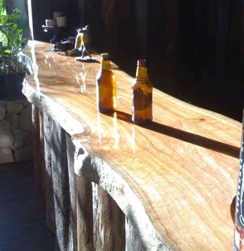 Our stunning range of solid wooden bar tops are crafted by our timber experts from our sussex based. Timber Slabs - Timber & Stone Design