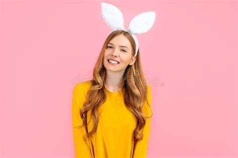 Happy Stylish Woman In Easter Bunny Ears Isolated On Pink Background