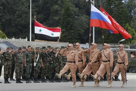 putin makes first visit to syria lauds victory over isis and announces withdrawals the