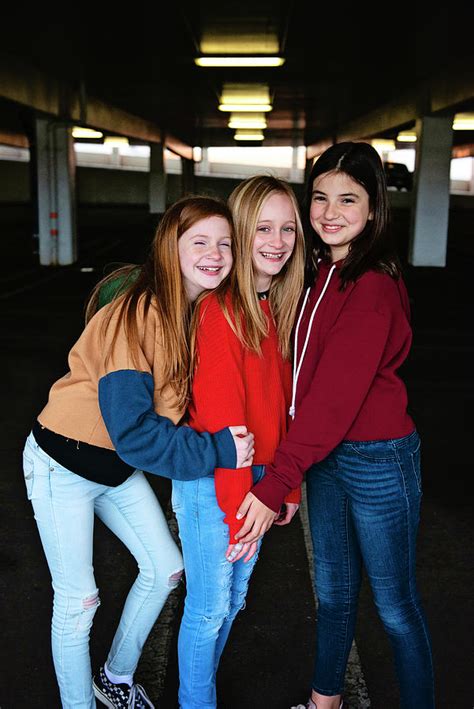 Three Cute Tween Girls Laughing Together Photograph By Cavan Images
