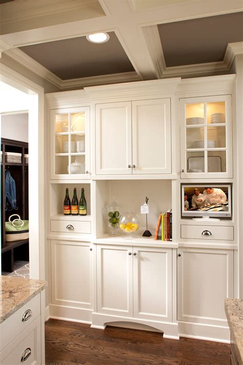 Conversion varnish provides better elasticity than other paint, making these doors more durable and easier to clean. White Butler's Pantry creates an easy access for entertaining, drinks, or food. Lighted accents ...