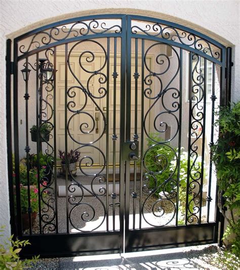 Wide variety of designs and finishes. Arched Decorative Double Courtyard Entry Gate | Iron gate ...