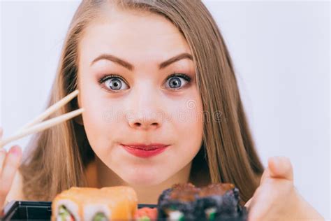 Cute White Girl Surprised To Taste Japanese Sushi For The First Time Close Up Stock Image
