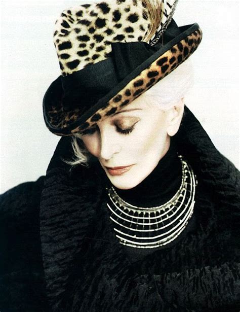 A Woman With White Hair Wearing A Leopard Print Hat