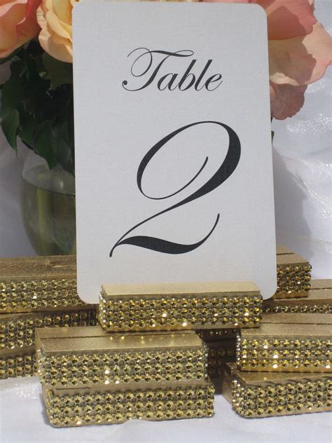 Gold Wedding Table Number Holder Trimmed With A Gold Crystal Wrap