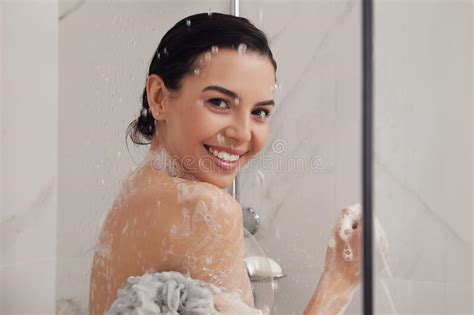 Young Woman With Mesh Pouf Taking Shower At Home Stock Image Image Of Naked Person 219546185
