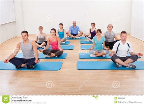 Group Of People Practicing Yoga Meditating Stock Image Image Of