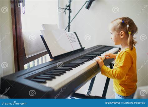 Adorable Little Girl Playing Piano Stock Photo Image Of Musical