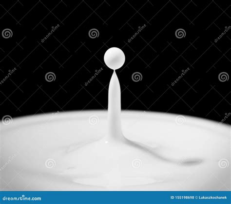 Drop Of Milk Milk Droplet Falling On White Liquid And Creating Splash
