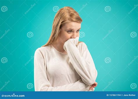 A Thoughtful Woman Who Supports Her Chin With Her Hand Stock Photo