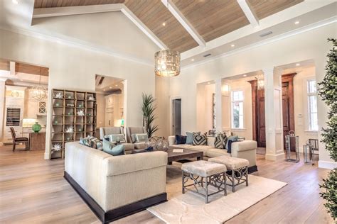 While high ceilings are architecturally appealing, they present challenges for installing light fixtures, so consider these vaulted ceiling lighting options. vaulted ceiling lighting living room contemporary with ...