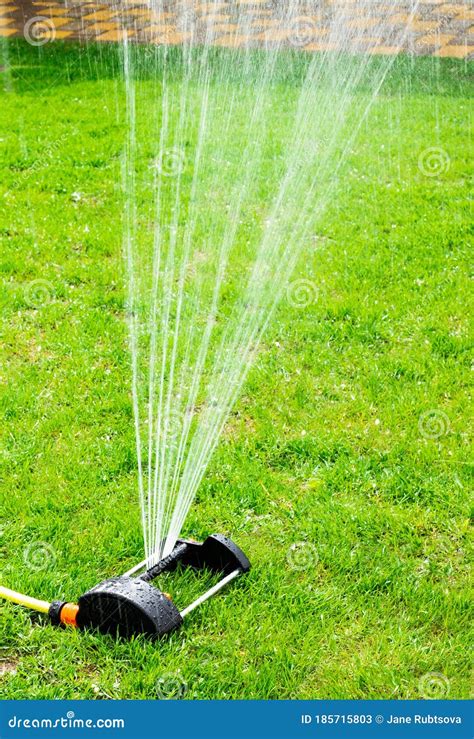 A Working Portable Lawn Watering Machine Water Jets For Irrigation Of